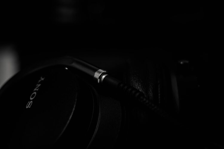 Dark background, close up of black Sony headphones